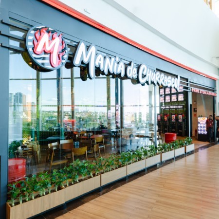 Logo da loja mania de churrasco